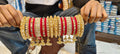 Royal Kundan Bridal Chuda Set with Golden Jhumki Latkans – Red & Gold Wedding Bangles