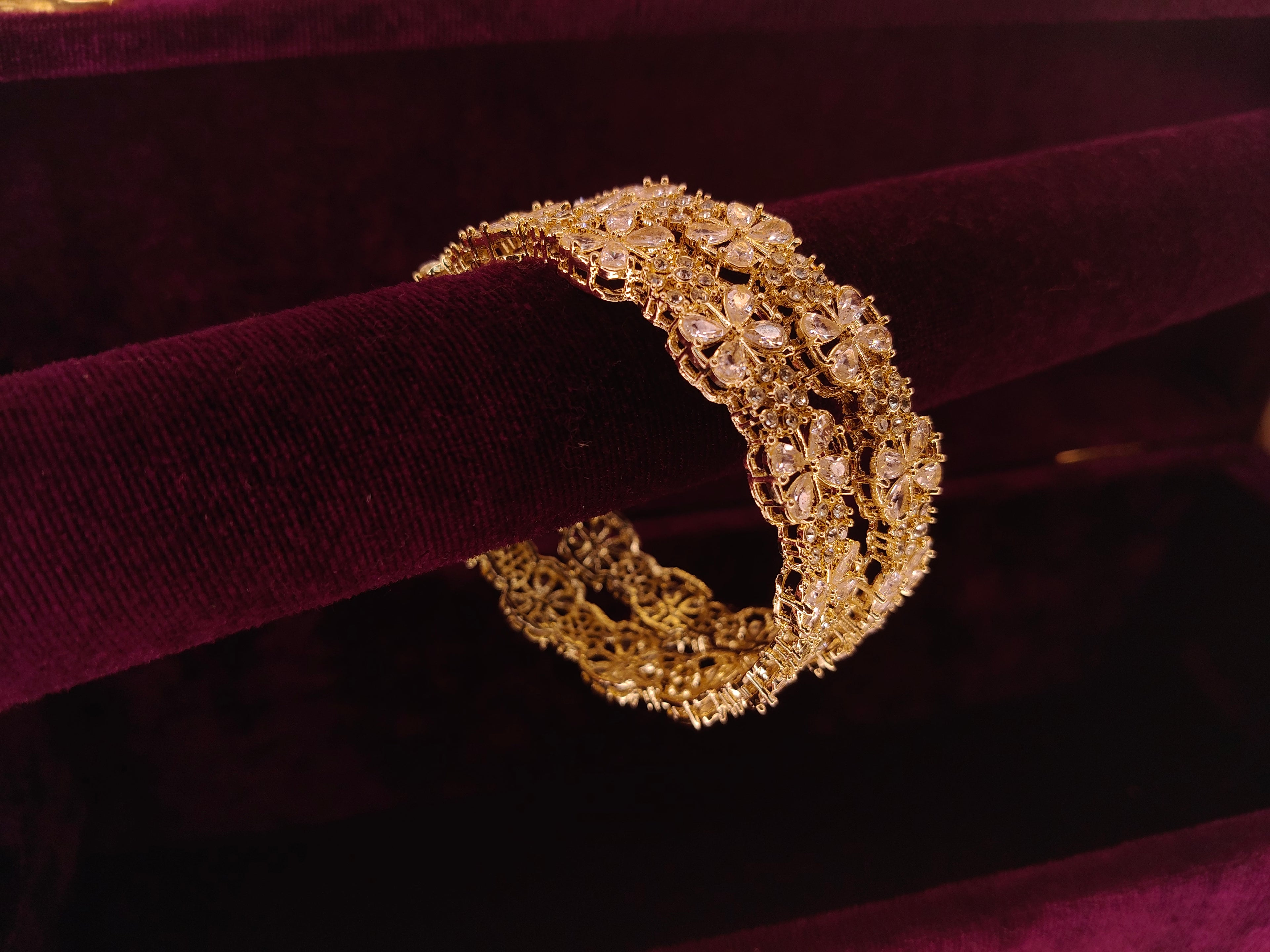 gold colour kada with daimond work